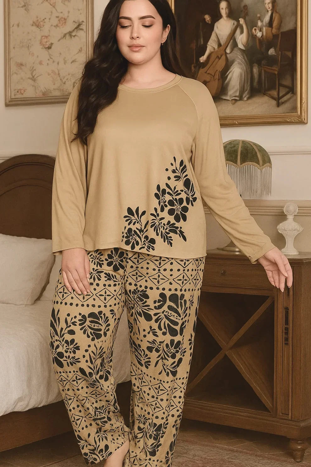 Woman wearing a beige top and patterned pants in a room with decorative elements.