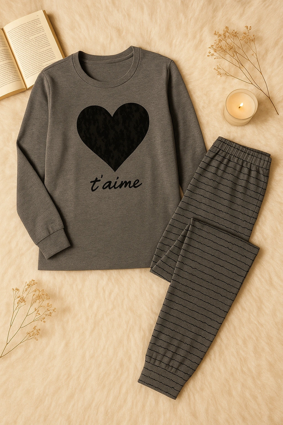 Gray pajama set with heart design and 't'aime' text on a beige background